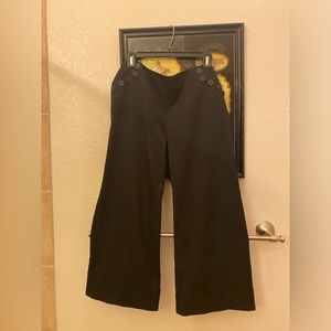 Black cuffed capri pants with top side buttons. Size 10, back zipper. Worn once.